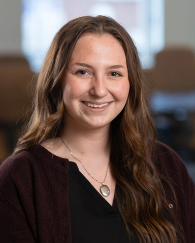 smiling person in professional attire